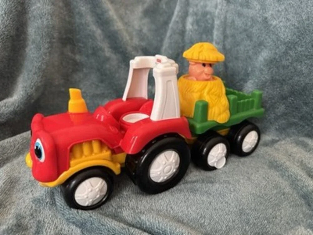 This 2007 Fisher-Price Little People Tow 'n Pull Tractor